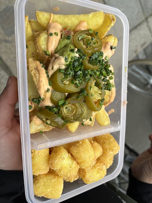 Guacamole loaded fries (top) and tater tots (bottom )  at Swing Kitchen in Leipzig