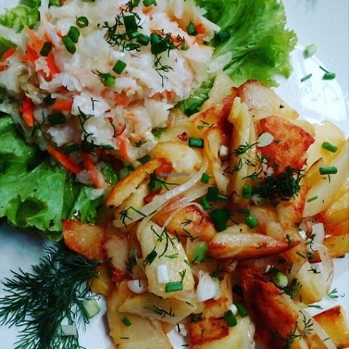 Russian style fried potato with onions. Served with homemade marinated cabbage and dill. Vegan, tasty and healthy food in Bamboo Bar Sihanoukville. at Bamboo Bar & Vegetarian Restaurant in Sihanoukville