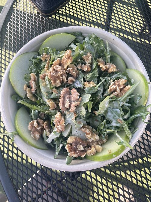 Arugula salad with walnuts, crisp green apples and an apple cider vinegar dressing. Just ask for no cheese to make it vegan .  at Lucky Penny in Santa Barbara