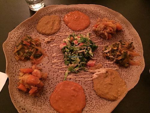 Ingera platter with four traditional Ethiopian dishes, and salad. at Tenat in Tel Aviv