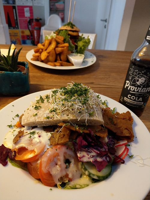 Kebab (Haita Teller) and Steak Burger with wedges (back) at Krawummel in Muenster