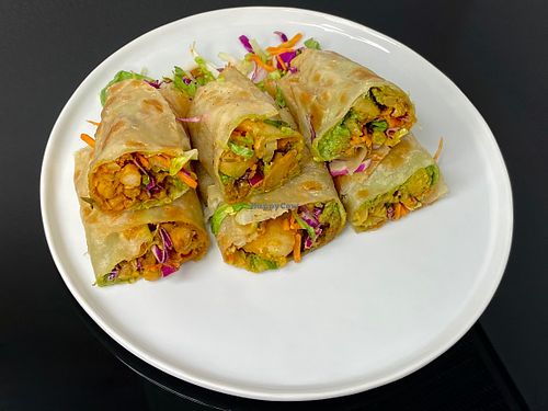 L to R: chana masala, achari aloo, aloo gobi matar (cut in half + plated at home) at The Roll Pod - White Center in Seattle