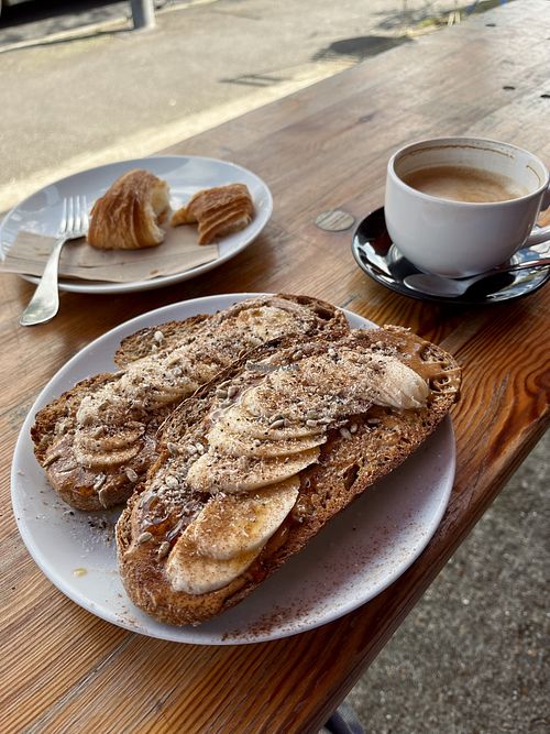 Vegan banana & peanut butter sourdough toast with a vegan croissantt  at Tilt in Brighton