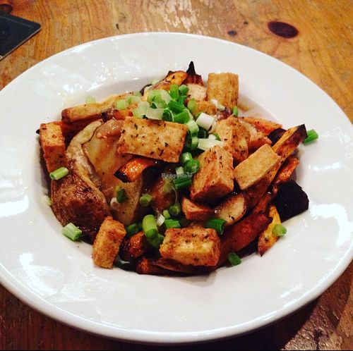 vegan poutine with tofu, sweet potatoes, russet potatoes, and miso gravy! at The Foggy Goggle in Halifax