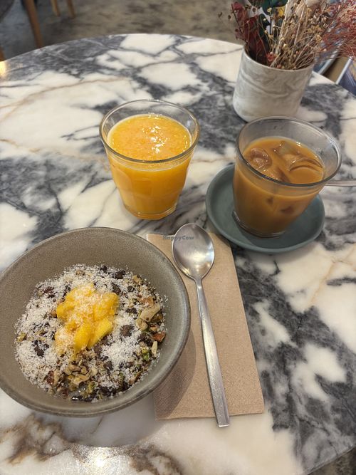 Vegan Chia Pudding, fresh orange juice, cold brew with oat milk  at Hello, Kristof in Lisbon