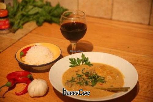 red curry soup with a side of white rice. at HaMitbach HaTailandi in Pardes Hana