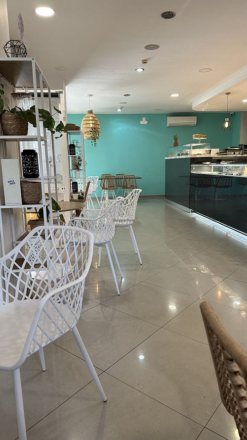 Tables inside and outside as well  at The Garden Bakery - Online in Portimao