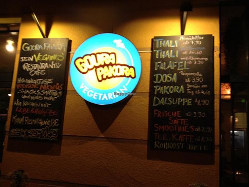 sign at night  at Goura Pakora in Berlin