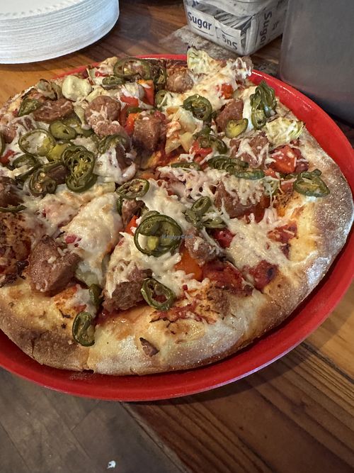 Vegan cheese, beyond sausage, jalapeño, red peppers, red onion, artichoke hearts    at Pizza Port in Carlsbad