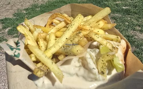 Falafel sandwich buried in Zatar fries at Noam's Table  in Cheyenne