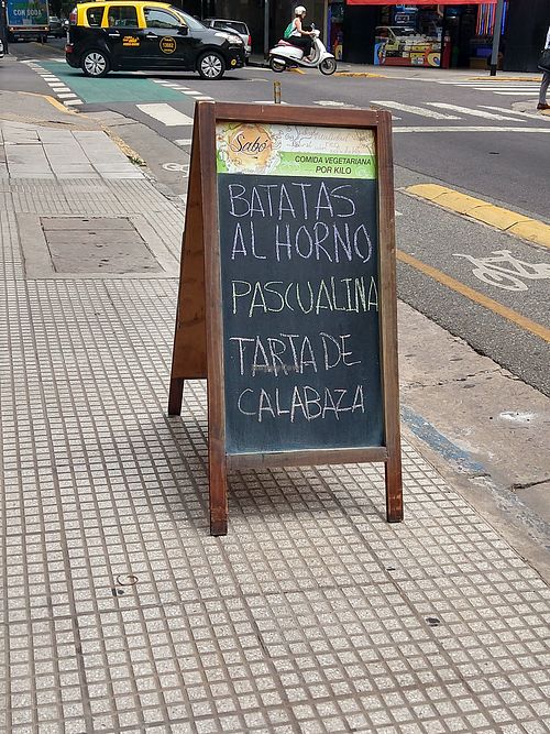 Sidewalk sign at Sabó  in Buenos Aires