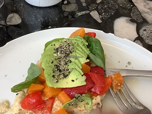 Vegan toston, with pumpkin, red peppers, humus, basil, and avocado  at Flora  in Montevideo