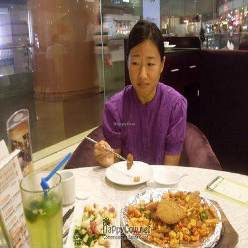 Despite my facial expression, the food here was actually very good!!! at New Age Veggie - Super Brand Mall in Shanghai