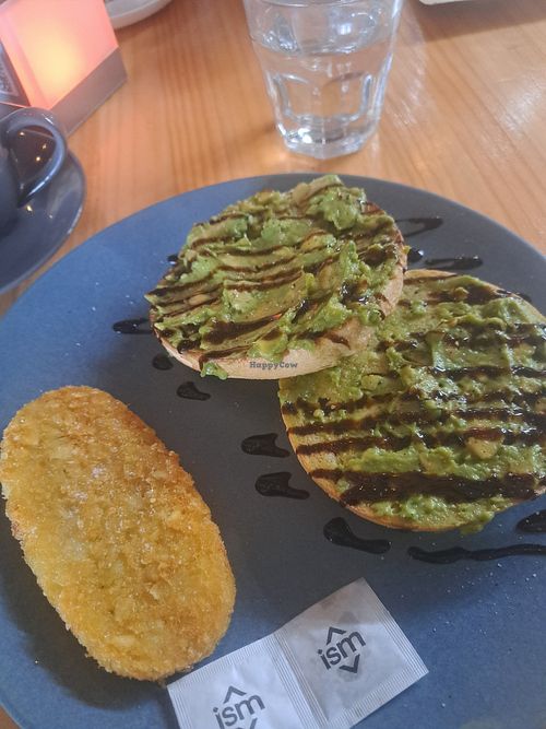 Avo on a bagel option with a hash brown. Make sure to ask for no butter. at Roots Collective in Sarina