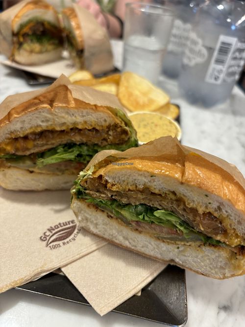 “Cheese steak” and the veggie something both in vegan version and delicious. I expected french fries instead of chips but they were tasty and made by them 😌  at Savta in Barcelona