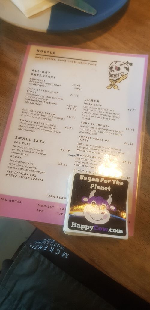Menu and happycow seal of approval at Hustle in Belfast