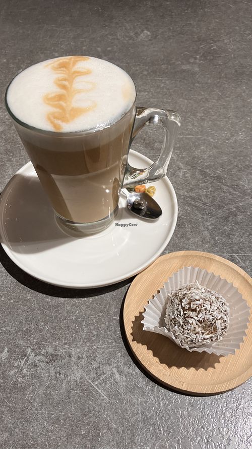 Latte with oat milk and tamarique. Note: Latte was offered with small chocolates, which seem to be not vegan, so ask the staff not to bring them.  at ALTAR in Yerevan