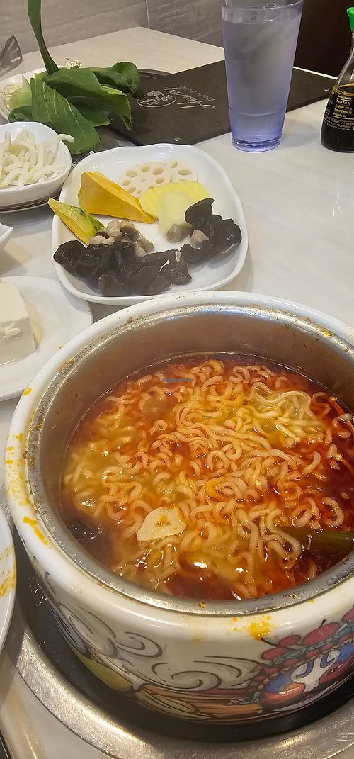 Tom yum broth with ramen at Homey Hot Pot in Bloomington