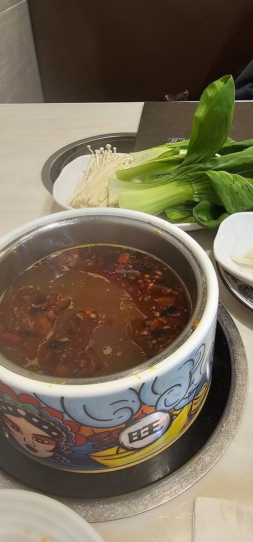 Hot & spicy broth at Homey Hot Pot in Bloomington