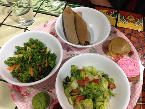 Side plate has: Strawberry cupcake (gf), Carmel cupcake (gf), Timatam salad, Shimbra salad & gf injera at Azla Vegan in Los Angeles