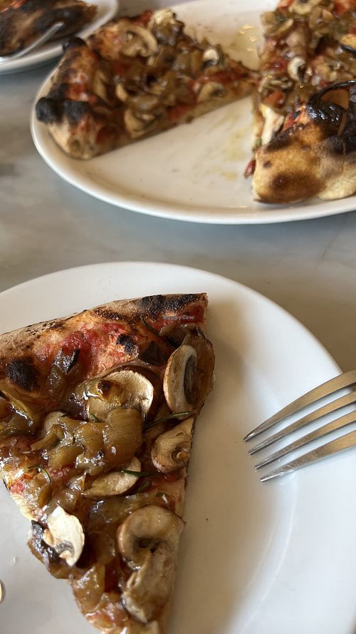 Fungo Pizza: Mushrooms, Caramelized Onions, Crushed Tomatoes & Rosemary at Hearth & Table in Lincoln City