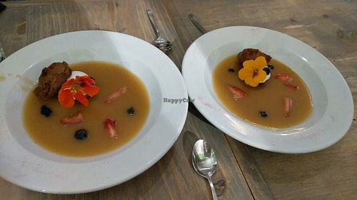 Sticky toffee pudding with edible flowers at enVie A Vegan Kitchen in Halifax