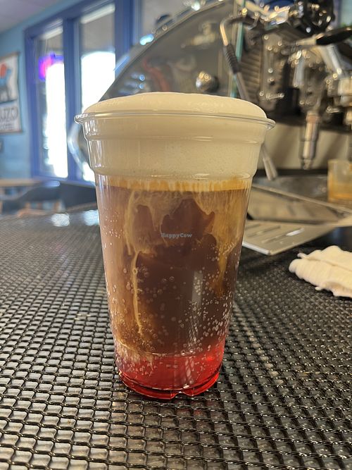 Raspberry espresso tonic with oat milk cold foam  at Ruzo Coffee in Boulder