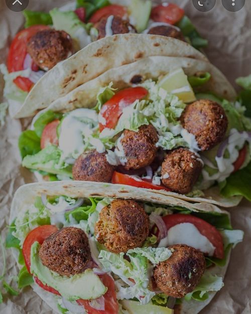 falafel tacos with lettuce , diced tomato/onion mixed and your choice of sauce ( hummus or eggplant) at Eat Like A Greek  in Edgewood