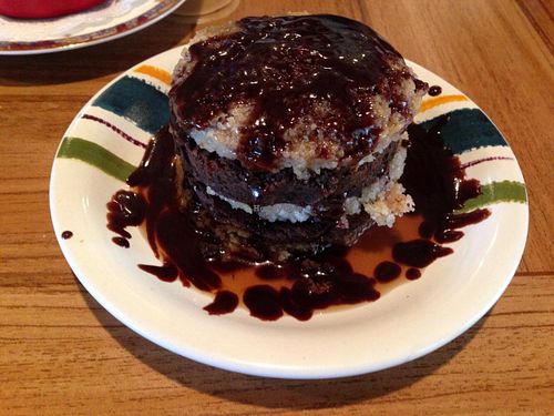 vegan tower cake with vanilla cake and brownie layers with a chocolate and caramel drizzle at Urban Vegan Cafe in Hilton Head Island