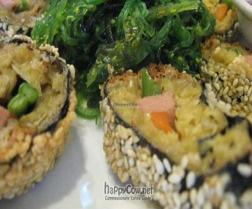 Sesame-crusted seaweed roll with mock meat and vegetables at the core; Chinatown's answer to sushi! Served with a pile of sea vegetables. at The Original Buddha Bodai - Kosher Vegetarian Restaurant in New York City
