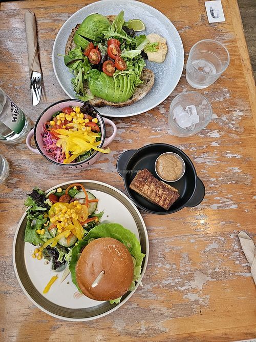 Burger with vegan cheese, coleslaw, sourdough with avocado, tofu with peanut sauce at Mad Cucumber in Bournemouth
