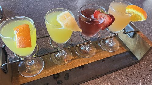  A flight of Mimosas: Champagne with orange, pineapple, cranberry, grapefruit juices at Biscuits Cafe  in Beaverton