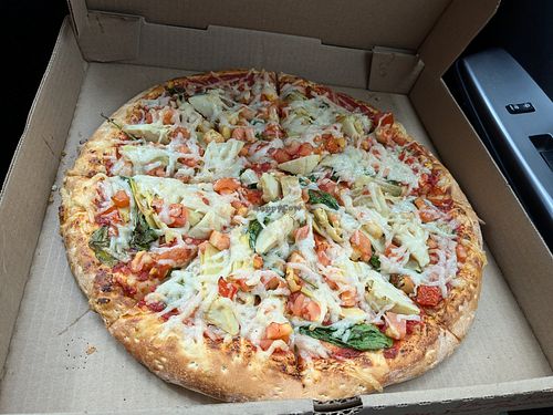 Our standard order --spinach, tomato, and artichoke hearts. at Mama Roni's Pizza in Fort Collins