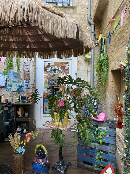 Cute place, to the right is a separate room for pregnant diners and those with small children (I think?) at Greedy Guts in Caen