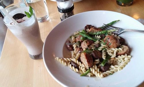 A seitan, mushroom, and asparagus pasta with a vegan mint choclate chip milkshake to indulge in. at Great Sage in Clarksville