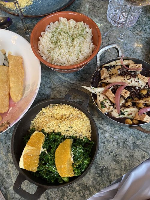 Feijoada( black bean stew) with rice and greens and farofa. fried yuca on the left  at Capoeira Restaurant in Jersey City