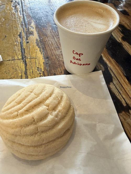 Concha and oat milk cappucino   at Catahoula Coffee Co in Richmond