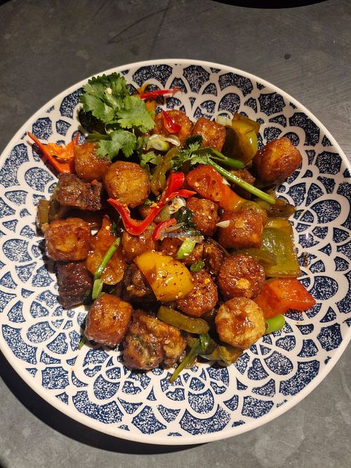 Vegan Bridgewater Breakfast Hash: Vegan sausage, rainbow peppers, house brown sauce, baby spinach, jalapenos and potato tots. at MAN - Bridgewater Exchange - T2 in Manchester