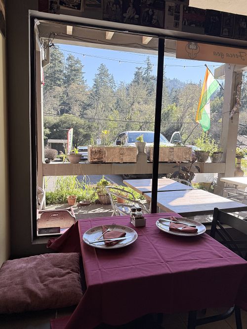 View of mountains and trees out the window  at Arti Cafe in Lagunitas-forest Knolls