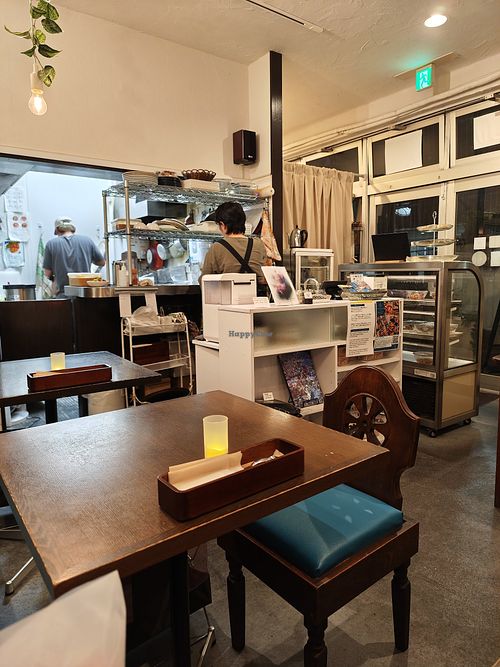 Inside + cashier + open kitchen at LOTUS CAFE TOKYO in Tokyo