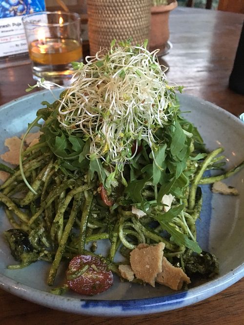 Basil sunflower pesto with olives, cherry tomatoes, rucola, zucchini noodles and bits of cheesy sundried tomato crumbles at The Garden Kafe at The Yoga Barn in Ubud