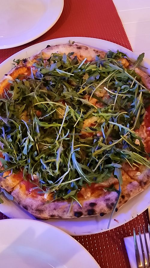 Vegan pizza with arugula at Pizza Napoli in Noord