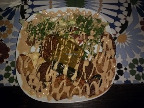 vegan plate with falafel, stuffed pepper, grilled legumes, salad and peanut sauce at Ibras Bistro in Erfurt