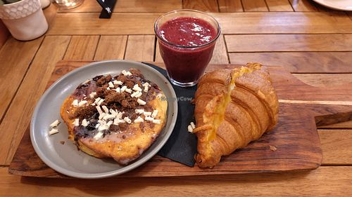 The veggie breakfast: cheese croissant, chocolatey gluten-free pancake, and a berry smoothie at Floor's Coffee & Brunch Bar in Leiden