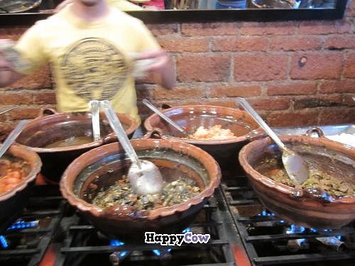 Ingredients are kept warm in clay pots. at Tacos Gus in Mexico City