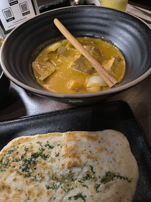 Masamam curry with homemade naan bread at Mercy Republic in Bangkok