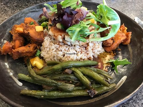 Spinach Tofu Cakes: Tofu patties w/ spinach, red pepper, spring onion & shiitake mushroom mixed together & served over steamed rice or brown rice w/ a raspberry soy sauce & greens on top & string beans & sweet potatoes on the side. at Mark's Kitchen in Takoma Park