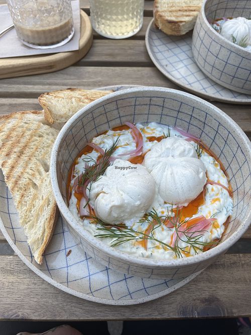 turkish style poached eggs with toasted bread for brunchh  at Piccola Cafe in Ljubljana
