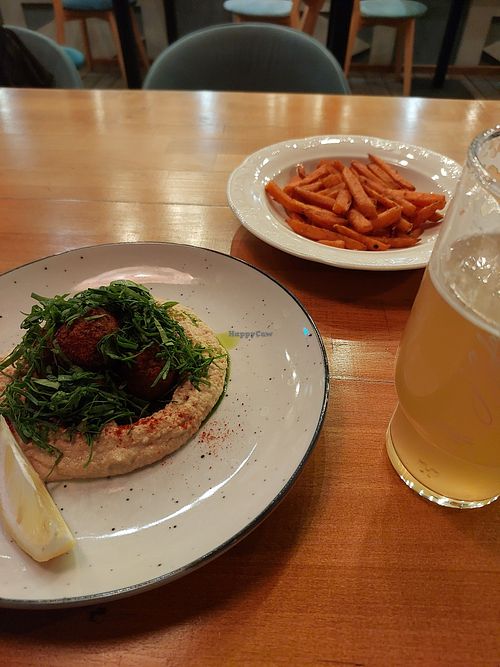 Hummus, falafel, batata fries and a wheat beer at Cream Soda in Mykolaiv