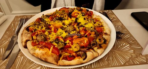 Vegan pizza with olives, mushrooms, peppers, aubergine, tomatoes, onion and vegan cheese.  at Lascito in Brigg
